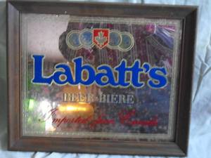 Labatts wood framed mirror. 17 x 14. As shown.