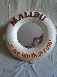 Malibu Rum life saver mirror. Styrofoam. Small piece missing on top. As shown.