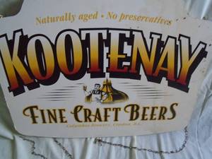 Kootenay Beer double sided wood sign. 24 x 19 Has some staining. As shown.