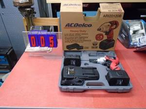 AC Delco 38 18 volt cordless impact with 2 batteries & 1 charger. Was a show display. Batteries & charger also work in lot # 6 & 25. As shown.