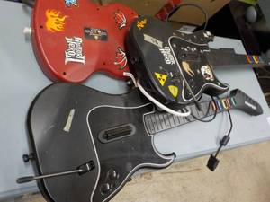 lot 184 image: Game Guitars and misc. cords in a P...