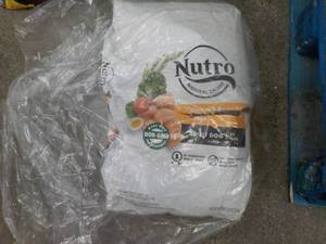 lot 212 image: Nutro Adult Dog Food 22 lb. but th...