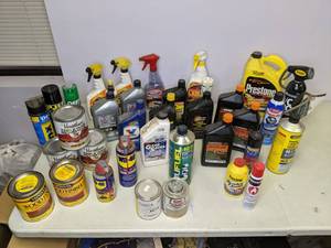 lot 174 image: Miscellaneous Auto Products Motor Oil, Chain Oil, Leather Care, Break Fluid, Freeze Off, and More - N
