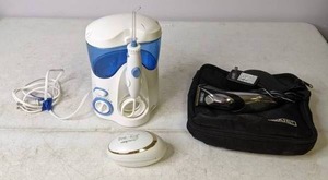 lot 150 image: Water Flosser, Ped Egg Easy Curve, & Wahl Razor - N