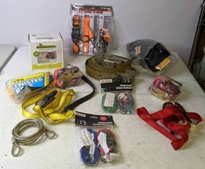lot 137 image: Mixed Lot of Tool Supplied Haul Master 1 x 15 FT. Ratchet Tie Downs, BrushGrubber Grubber Tugger Chain, Tool Bench Bungee Cords, & More - B