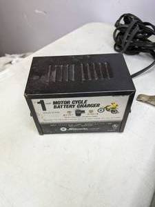 lot 214 image: Schumacher  1 AMP Motor Cycle Battery Charger 6 and 12 Volt LotHole Drill BitsTool Lot - B