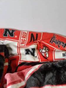 lot 229 image: Collection of 3 Throw Blankets Including Nebraska Huskers Throw - N
