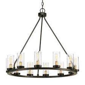 lot 69 image: Progress Lighting Hartwell 27 in. 12-Light Antique Bronze Farmhouse Wagon Wheel Chandelier with Clear Seeded Glass and Brass Accents