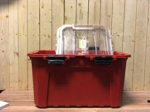 lot 59 image: Husky 20-Gal. Professional Duty Waterproof Storage Container with Hinged Lid in Red