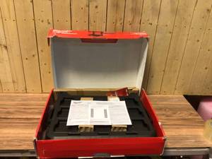 lot 74 image: Milwaukee PACKOUT 22.3 in. Black Resin Racking Kit with Metal Reinforced Frame and Integrated Handle Customer Returns See Pictures