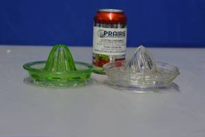 lot 15 image: 2 1930s 1940s glass juice reamers one white and 1 geeen depression made of glass