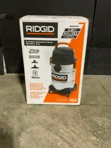 lot 26 image: RIDGID 6 Gal. 4.25-Peak HP Stainless Steel WetDry Shop Vacuum with Filter, Hose and Accessories. See Pictures