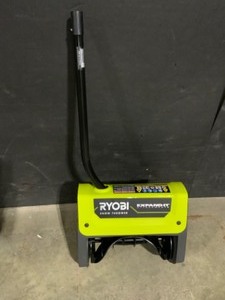 lot 28 image: RYOBI Expand-It 12 in. Snow Thrower Attachment. See Pictures