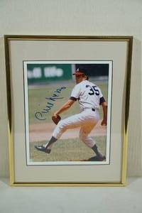 lot 9 image: Framed and Signed Phil Niekro 8 x 10 Picture
