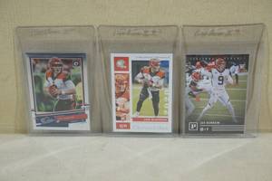 lot 98 image: 3 Joe Burrow Rookie Cards - Optic, Chronicles