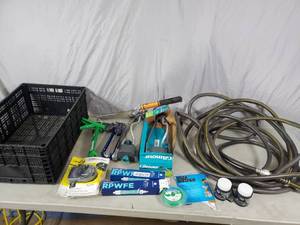 lot 75 image: Garden Hose, Sprinklers, Caulking Guns, and More