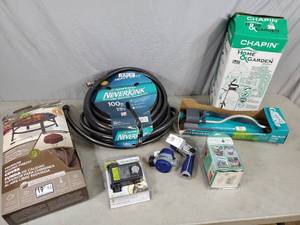 lot 163 image: Garden Hose, Firepit Cover, Sprinklers