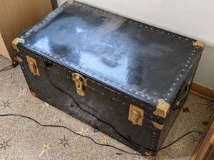 lot 51 image: Black Overland Steamer Trunk