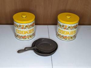 lot 44 image: Pair of Vintage Cookie Tins and Two Cast Iron Pans