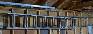 lot 47 image: Lot of 2 Extension Ladders-1- 8 Aluminum, 1- 12 Wood