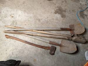 lot 17 image: 2 shovels, 1 axe, and 1 post hole d...