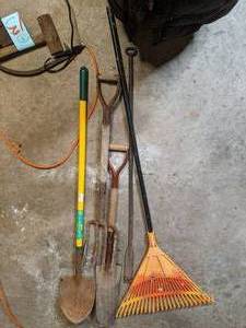 lot 18 image: 2 shovels, 1 pitchfork, 1 rake, and...