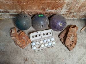 lot 52 image: 3 bowling balls, 11 golf balls, and...