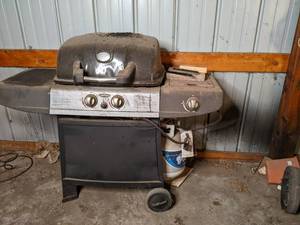 lot 30 image: Uniflame gas grill with propane tan...