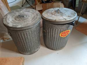 lot 249 image: 2 metal trash cans filled with bedd...