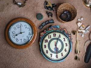 lot 117 image: 2 wall clocks, glass lamp filled wi...