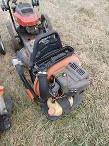 Lot with 2 Walk-Behind Trimmers and 2 Echo Backpack Blowers - Condition Unknown