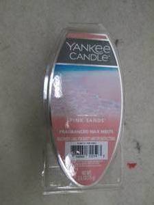 box full of yankee candle pink sand...