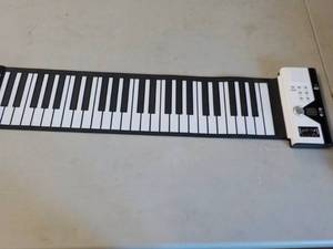 lot 23 image: Roll Up Piano tested and works...