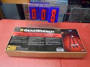 New Gear Wrench automatic clutch spring compressor. As shown.