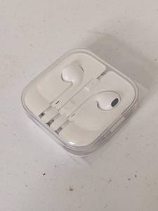 lot 57 image: NEW White Apple - Ear Buds