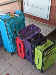 lot 127 image: Brightly Colored Luggage 4 Wheeled Bags, 1 Shoulder Bag