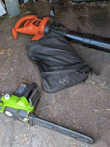 lot 134 image: Greenworks 14.5 Amp Corded 18 Chainsaw and Black & Decker Corded BlowerVacuum with Bag