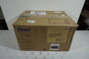 lot 183 image: NEW Oster 1.1 Cu Ft Stainless Microwave