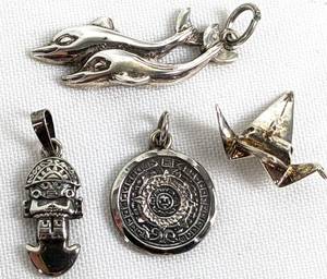 lot 276 image: Seven Sterling Items - Pendants, Necklace, Charms