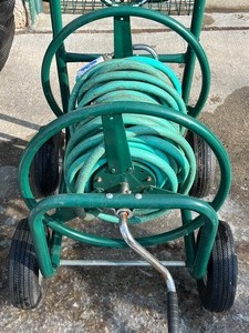 lot 320 image: Garden Hose Reel Cart and Garden Hose