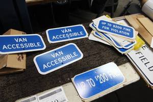 lot 1319 image: Lot of (15) Assorted Metal Handicap Parking Signs