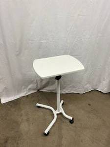 lot 35 image: Mobile Adjustable Desk Table. Height adjustable and tiltable. Smooth rolling casters with locks. Excellent Condition. 