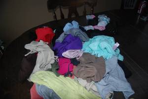 About 25 Womens size 11-13 tank top...