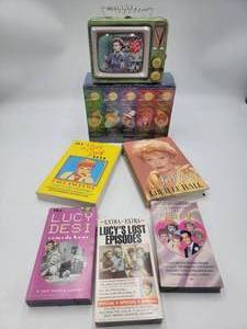 lot 12 image: Lucille Ball Collectors Lot-Never Opened 4 Tape Set of The Lucy Show The Lucy & Desi Comedy Hour Tape  Lucys Lost Episodes Tape  A Tribute to Lucy  This I Love Lucy Book  Love Lucy Autobiography Book  Lucy Collectible Tin Full of I love Lucy Memorabilia