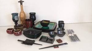 lot 124 image: Gorgeous 31 Piece Ceramic Serving Collection- Sushi Set, Green Glazed Plates, And More