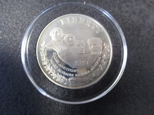 33. 1991-S Mount Rushmore Golden Anniversary US Commemorative 1oz Silver Dollar in Removable Protective Capsule