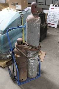 lot 723 image: Welding Set - Acetylene-Oxygen Tanks, Gauges, Hoses, Torch Wand, Tank Cart and Chains