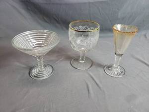 Crystal and Glass Wine Glasses, One is from Redwood Falls