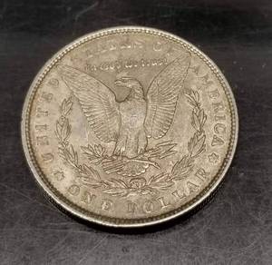 1887 MORGAN SILVER DOLLAR AU