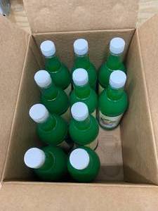 lot 110 image: Lot of 8 Bottles of Lemon-Lime Snow Cone Syrup (25 ounce Bottles)